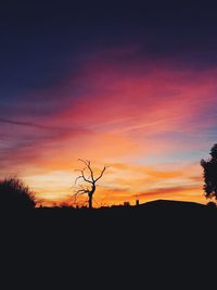 Silhouette landscape against sky during sunset