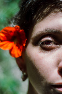 Close-up of woman wearing flower