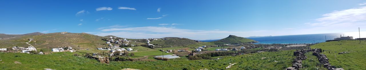 Panoramic view of land and sea against sky