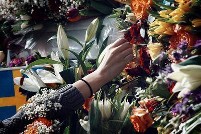 Close-up of hand holding bouquet