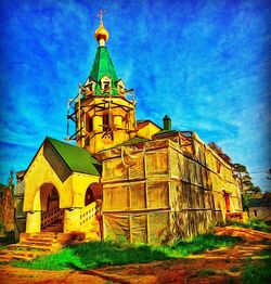 Low angle view of church against blue sky