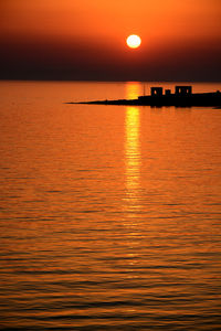Scenic view of sea at sunset