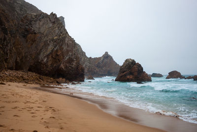 Scenic view of beach against sky