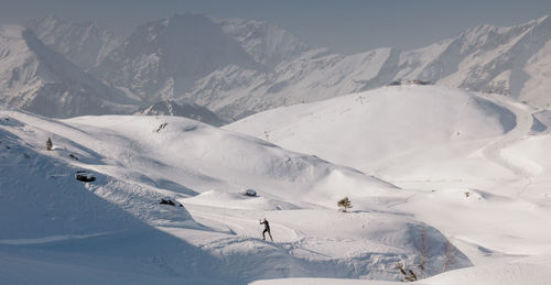 Cross-country skiing at the resort of alpe d'huez in the middle of the snowy mountains in oisans 