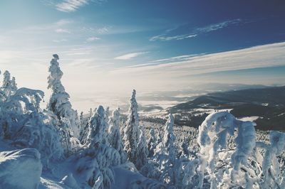 Scenic view of snow covered mountain against sky