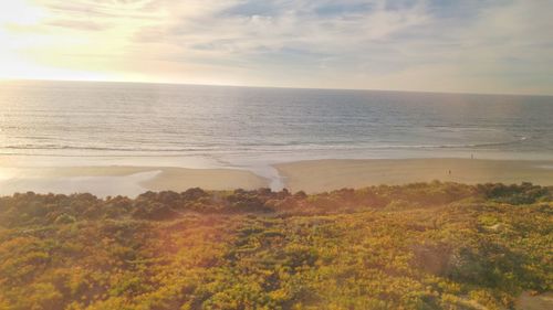 Scenic view of sea against sky at sunset