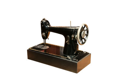 Close-up of machine part against white background