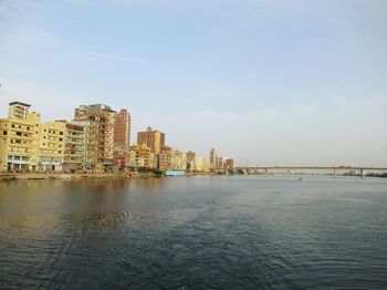 City by sea against sky