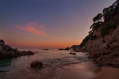 Scenic view of sea against sky at sunset