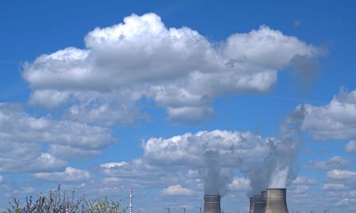 Low angle view of smoke stack against sky