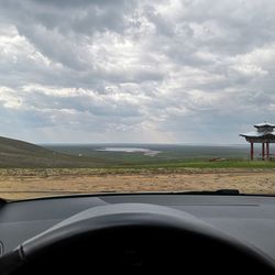 Scenic view of landscape seen through car windshield