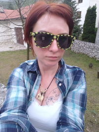 Portrait of young woman wearing sunglasses