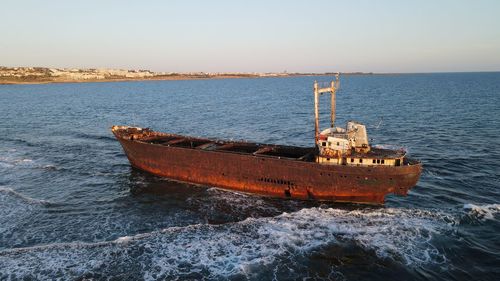 Boat in sea against clear sky