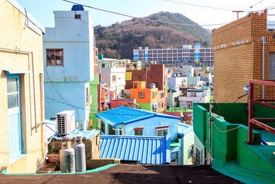 Houses in town against sky