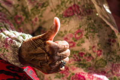 Close-up of hand gesturing thumbs up