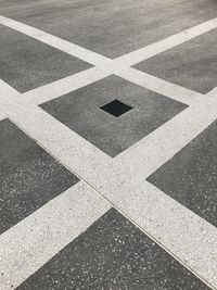 High angle view of arrow symbol on road