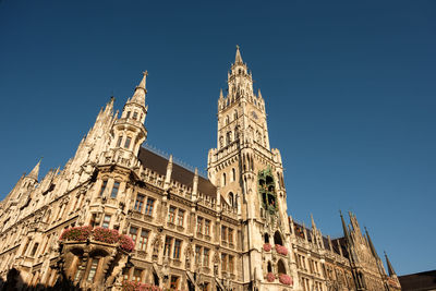 Low angle view of historical building against blue sky