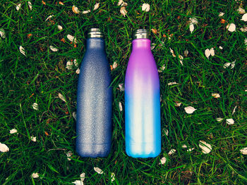 High angle view of blue bottle on field
