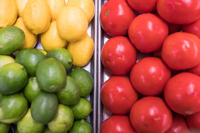 Close-up of fruits with tomatoes for sale in market