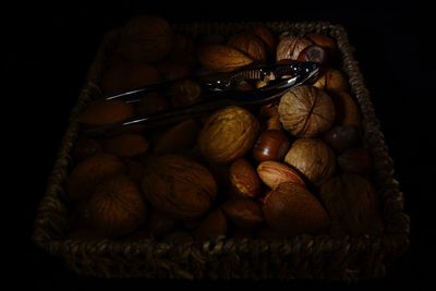 High angle view of fruits in black background