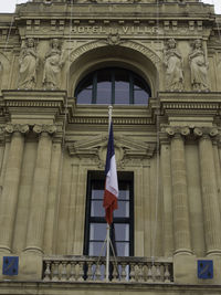 Low angle view of flag on building