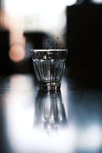 Close-up of glass of water on table