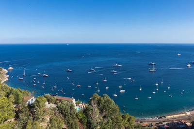 High angle view of sea against blue sky