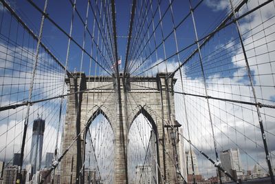 Low angle view of bridge against blue sky