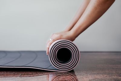 Low section of woman sitting on table