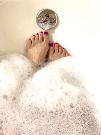 Low section of woman in bathroom