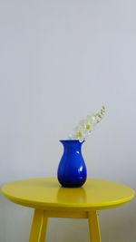 Close-up of bottle on table against white background