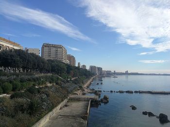 City by sea against sky