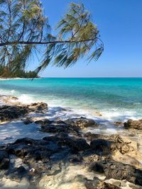 Scenic view of sea against clear blue sky