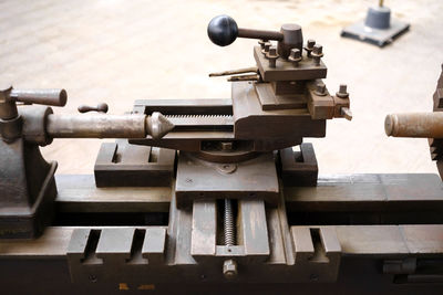 Cropped hand of man repairing machine