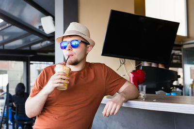 Midsection of man holding ice cream