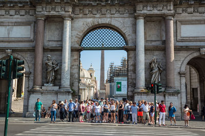 Group of people in front of historical building