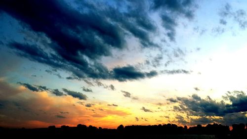 Low angle view of dramatic sky during sunset