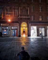 Silhouette of people in city at night