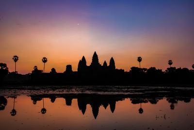 Silhouette of temple against sky during sunset