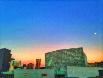 Buildings in city at dusk