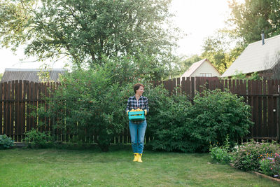 Full length of boy standing on grassy field