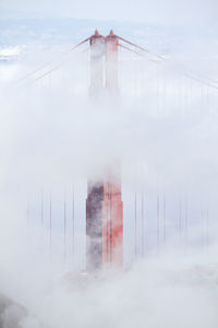 Built structure against sky during foggy weather