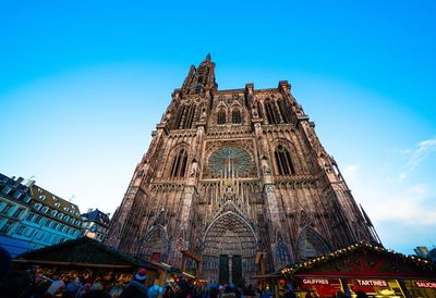 Low angle view of temple building against blue sky