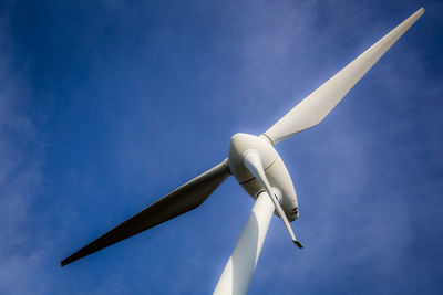 Low angle view of wind turbine against sky