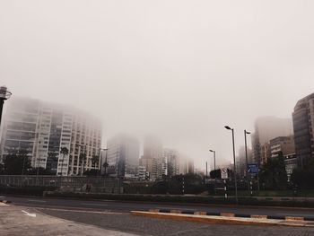 Buildings in city against sky