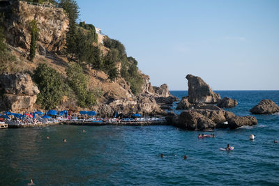 Scenic view of sea and rocks against sky