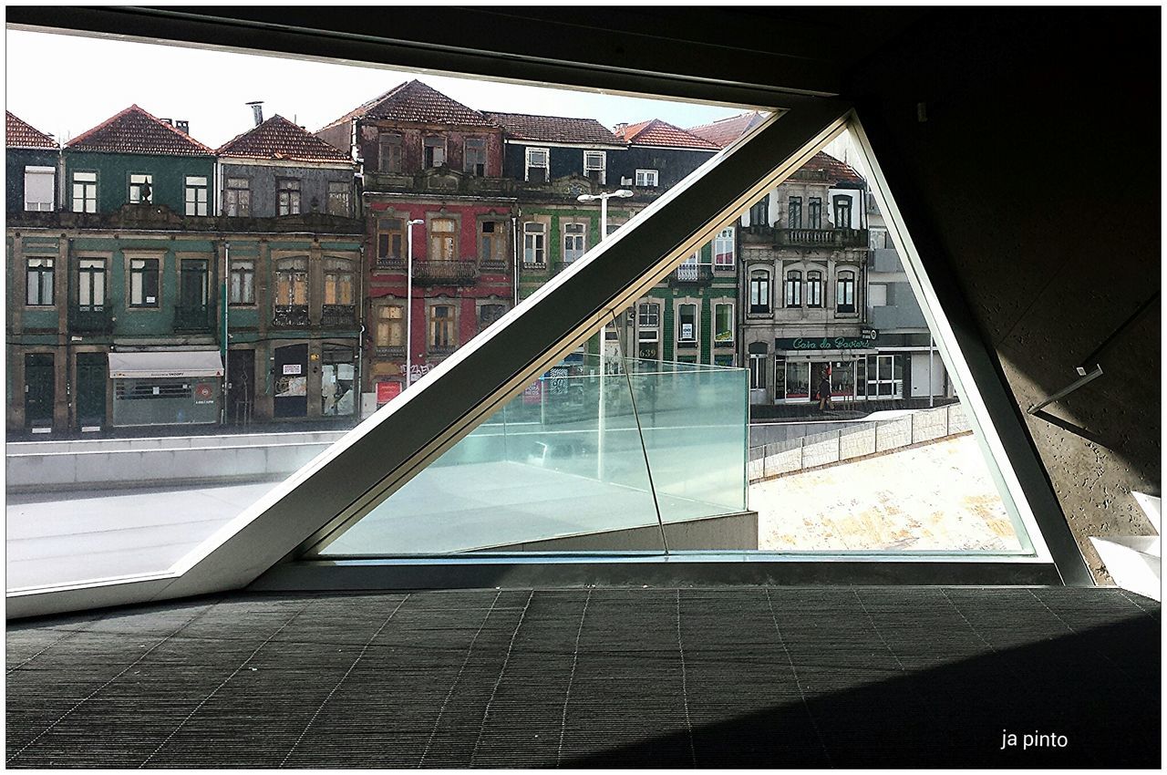 REFLECTION OF BUILDINGS IN WATER