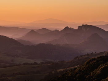 Scenic view of mountains against sky during sunset