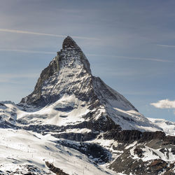 Scenic view of snowcapped mountain against sky