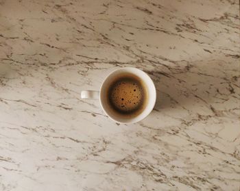 High angle view of coffee cup on table